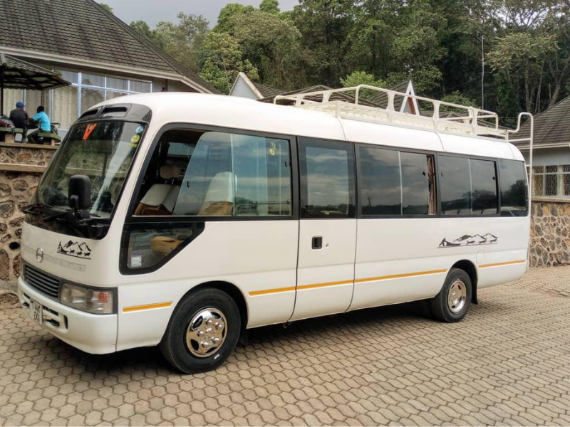Image of a car named Min Bus Coaster available for rental at Forbhic Travel with a description that says Spacious and comfortable, the Min Bus Coaster is perfect for group travel and family adventures. Ideal for safaris or city tours with plenty of room for passengers and luggage.

Capacity: Up to 30 passengers

Engine: 4.0L 4-cylinder turbocharged diesel

Transmission: Automatic

Features: Spacious interior with high ceilings and large windows

Ideal For: Group tours, airport transfers, and corporate outings